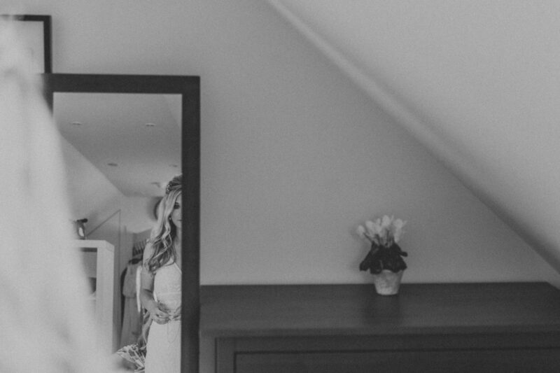 bride seeing herself in the mirror