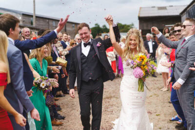 Couple exit wedding