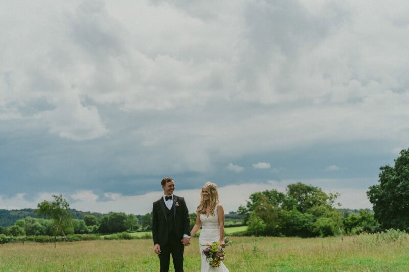 Bride and groom portrait in a field