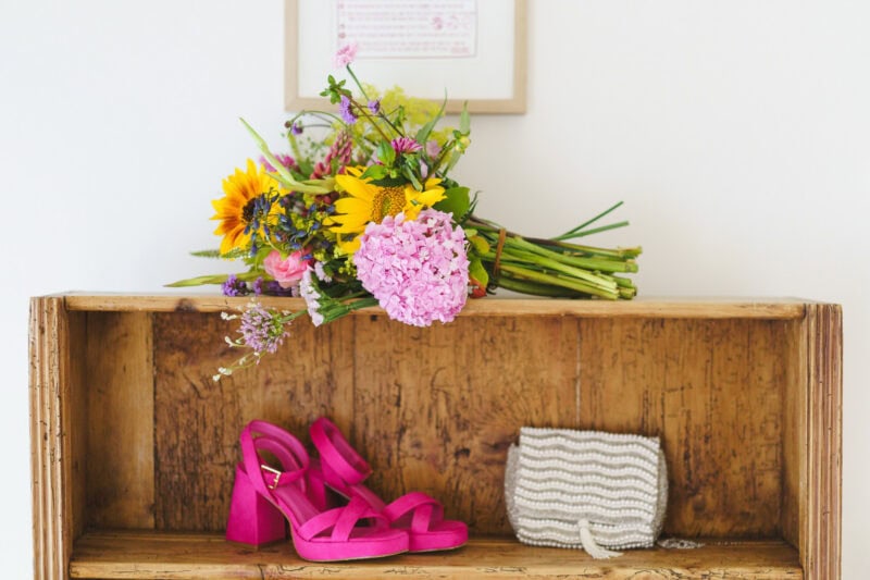 brides shoes, handbag and flowers