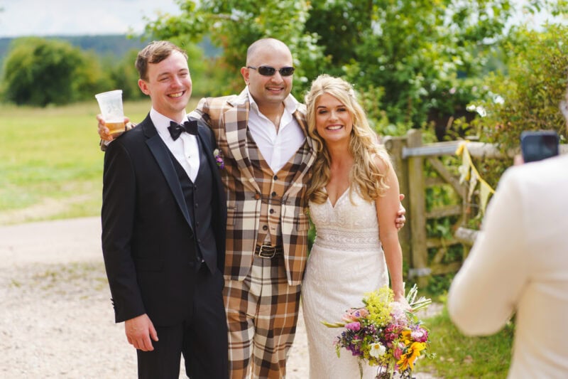 Bride and groom with guest