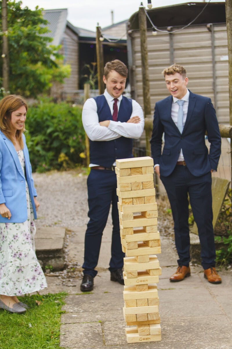 wedding guests play giant jenga