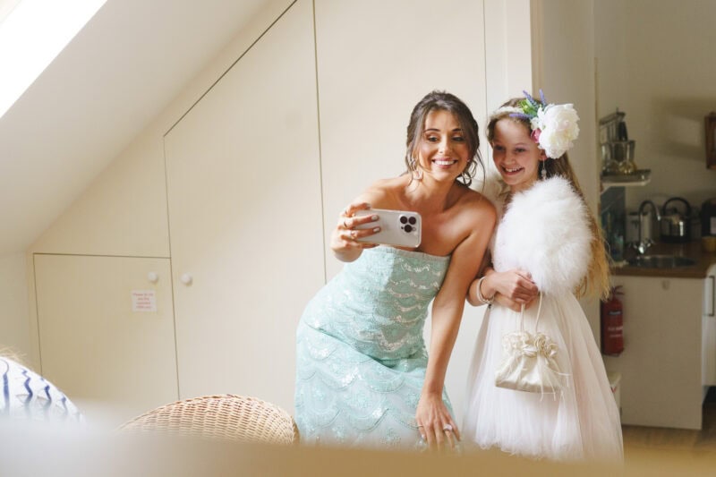 bridesmaid and flower girls taking a selfie